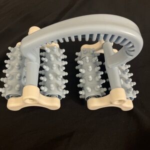 Hand held massage roller